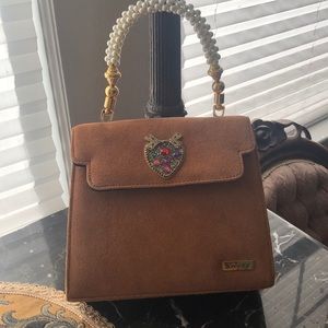 Suede purse with pearl handle